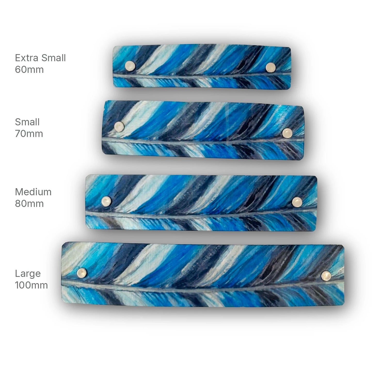 Four rectangular feather-patterned hair accessories in different sizes (Extra Small 60mm, Small 70mm, Medium 80mm, Large 100mm) arranged vertically on a white background, each with two silver metal rivets and labeled with its size.