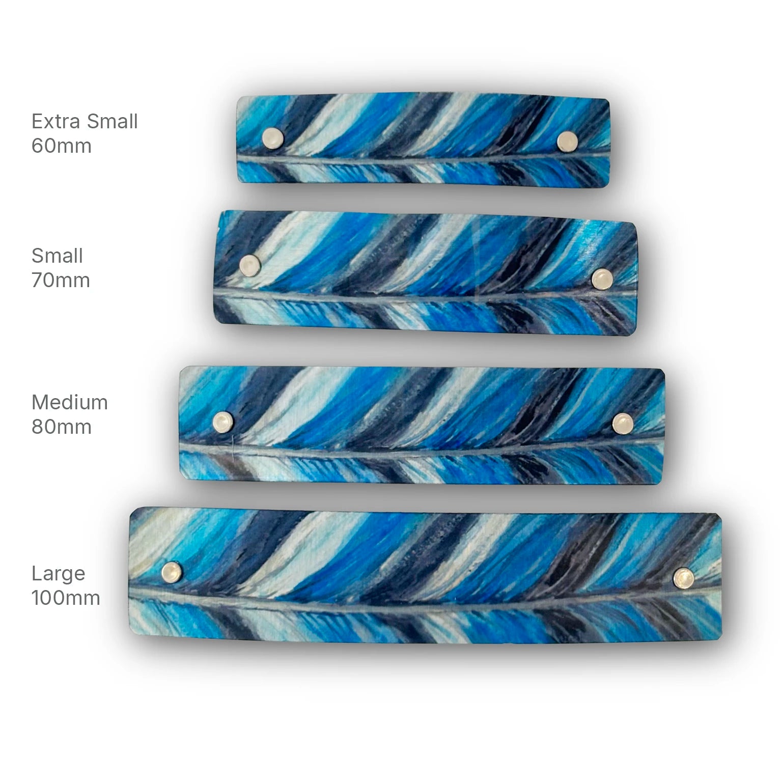 Four rectangular feather-patterned hair accessories in different sizes (Extra Small 60mm, Small 70mm, Medium 80mm, Large 100mm) arranged vertically on a white background, each with two silver metal rivets and labeled with its size.