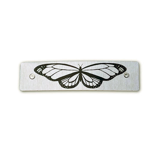 Silver toned boutique metal hair clip, featuring a detailed black butterfly design.