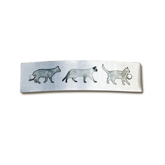 Silver and black original cat artwork is featured on this sturdy handmade barrette.