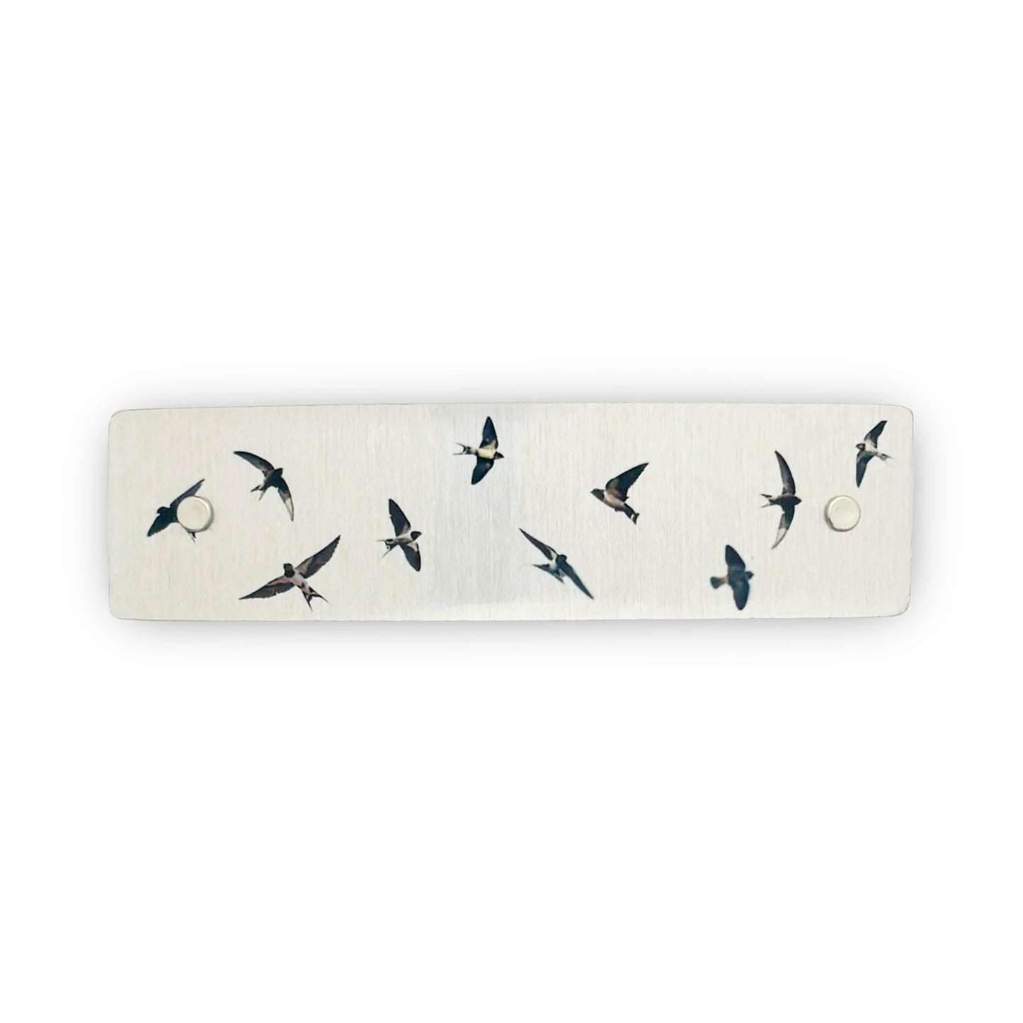 Silver metal boutique hair clip decorated with flying swallows.