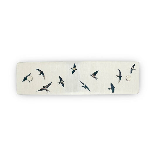 Silver metal boutique hair clip decorated with flying swallows.