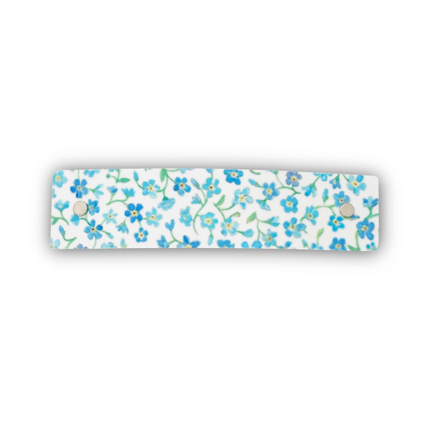 Hair clip decorated with original watercolor artwork of a dainty blue floral design.