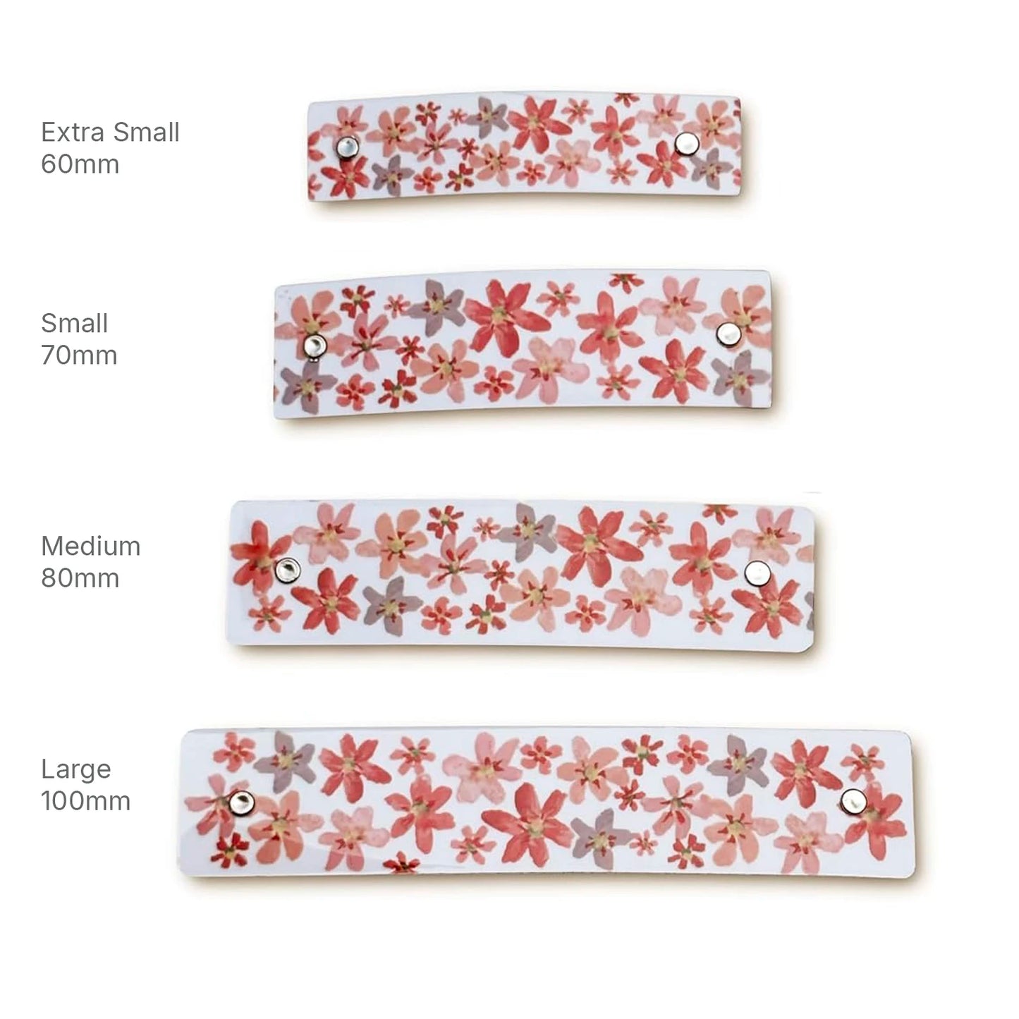 Four floral-patterned boutique hair barrettes shown in different sizes labeled Extra Small 60mm, Small 70mm, Medium 80mm, and Large 100mm on a white background.