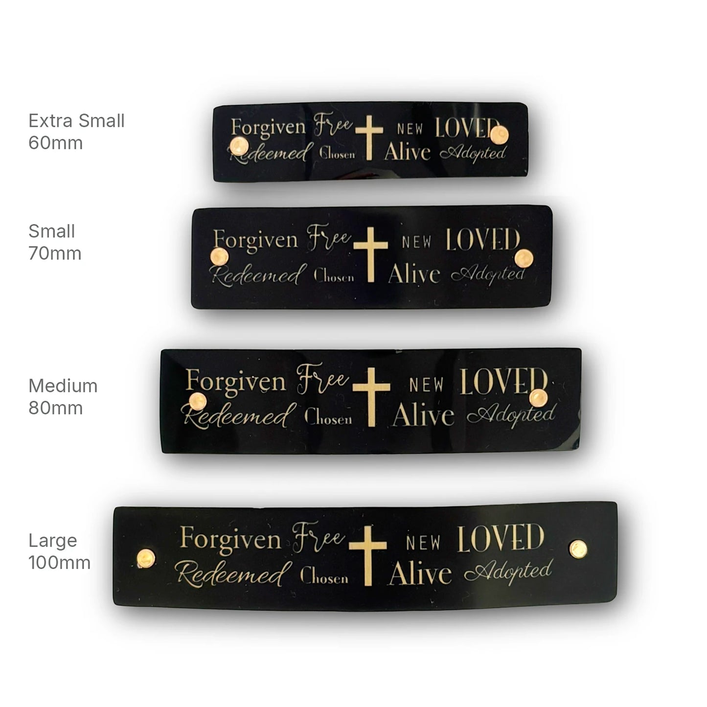 Four black rectangular religious theme French barrettes with gold lettering and a gold cross, shown in extra small, small, medium, and large sizes on a white background with size labels.