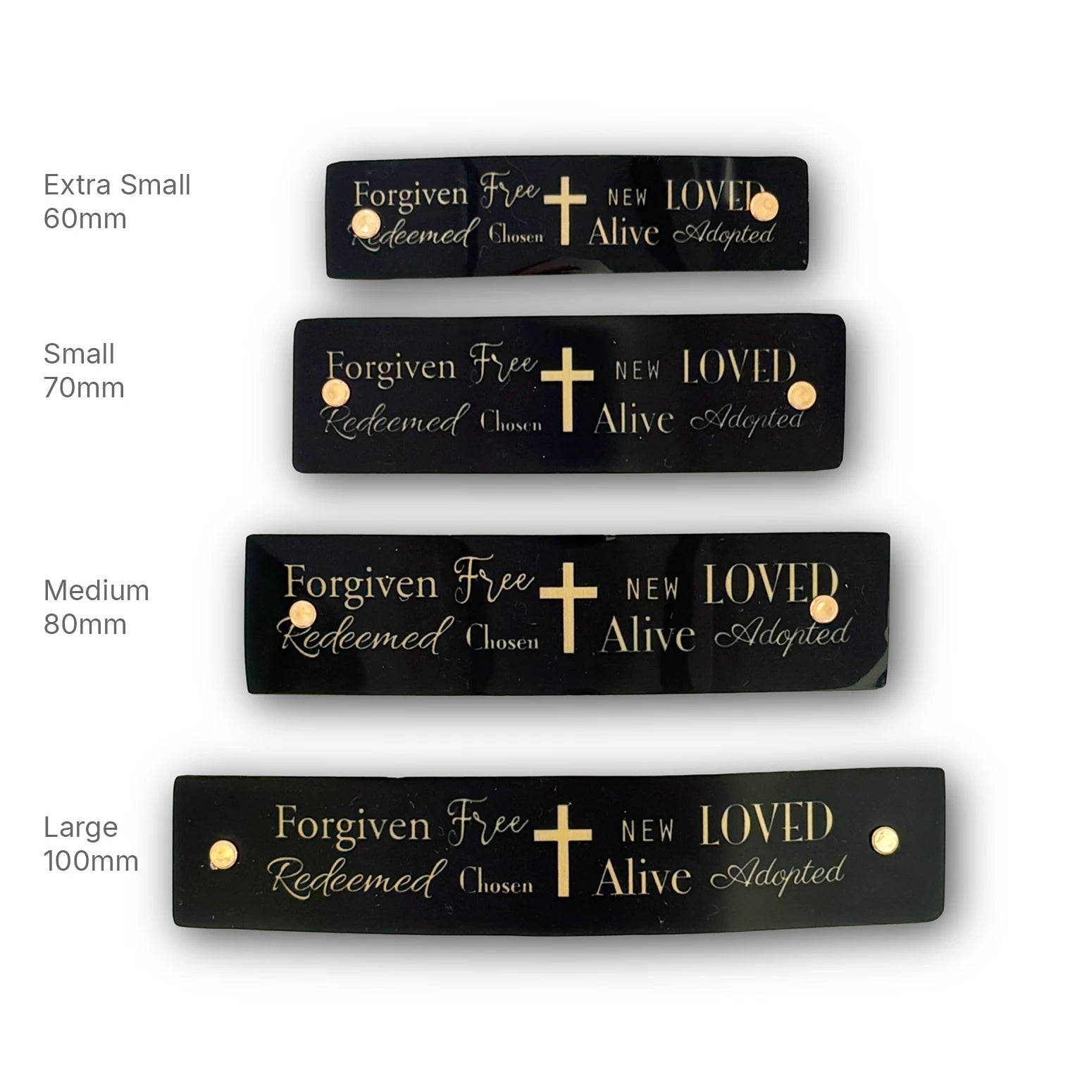 Four black rectangular religious theme French barrettes with gold lettering and a gold cross, shown in extra small, small, medium, and large sizes on a white background with size labels.