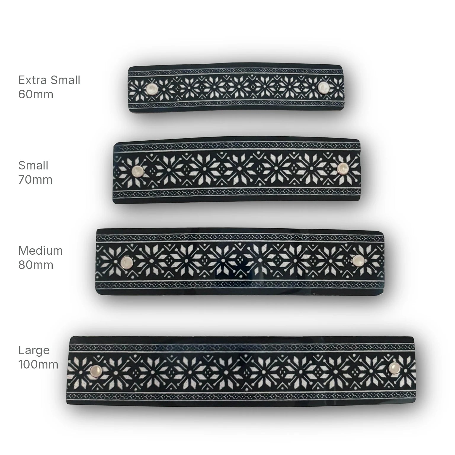 Four black hair clips with silver snowflake stars,, shown in sizes Extra Small 60mm, Small 70mm, Medium 80mm, and Large 100mm on a white background with size labels. 