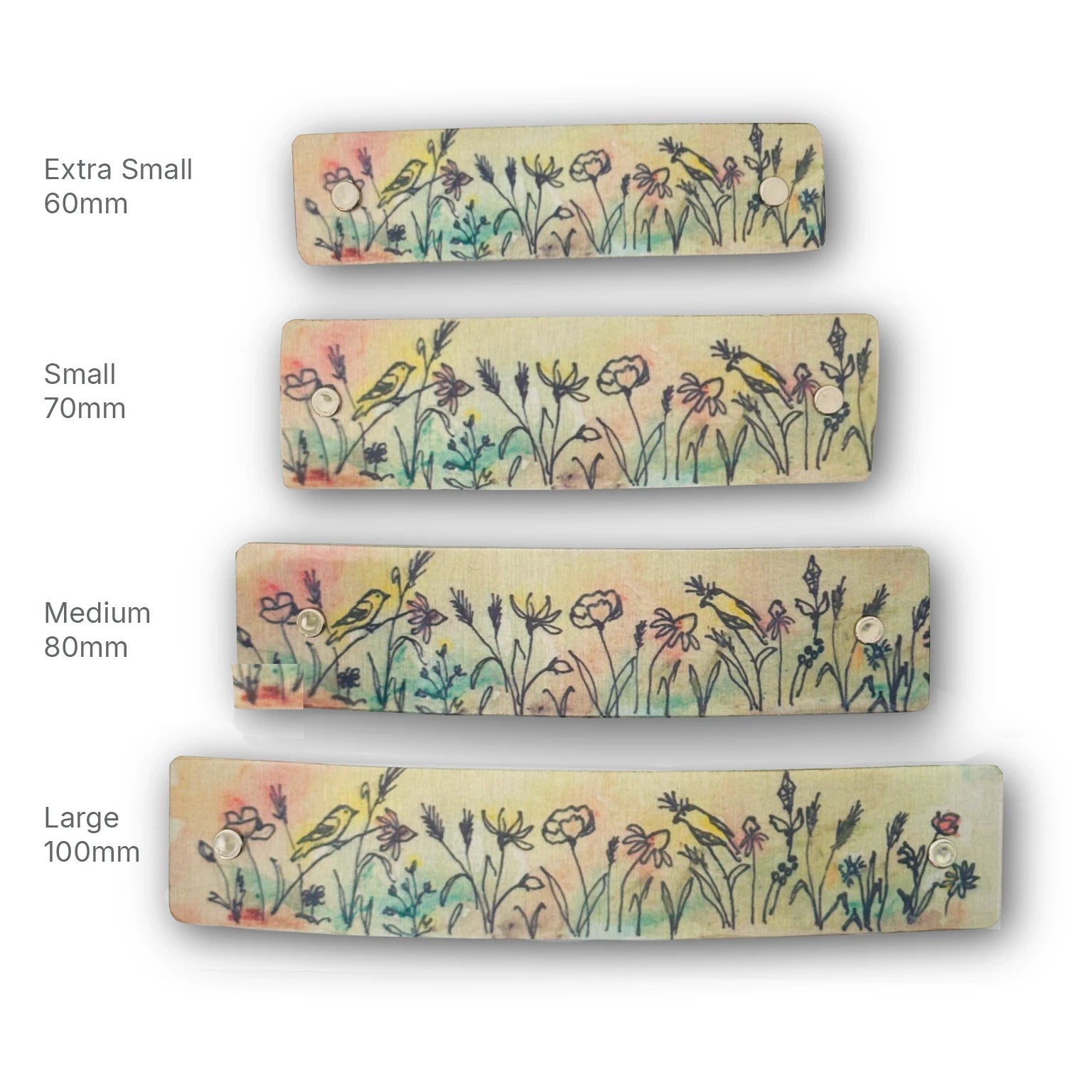 Four floral and bird-themed boutique handmade hair clips, shown in different sizes labeled Extra Small 60mm, Small 70mm, Medium 80mm, and Large 100mm on a white background.