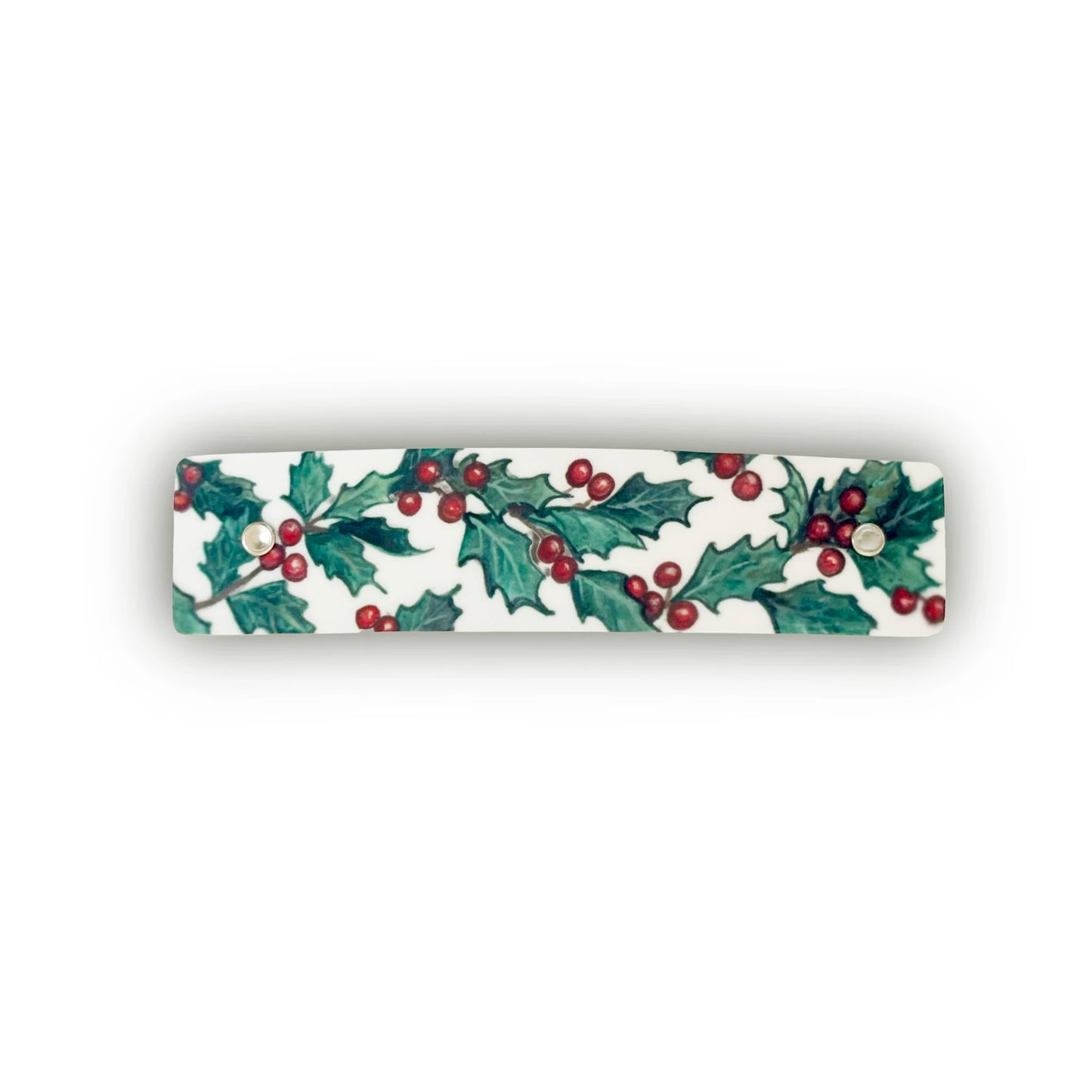 A rectangular white hair clip, featuring a watercolor pattern of green holly leaves and red berries, shown on a plain white background.