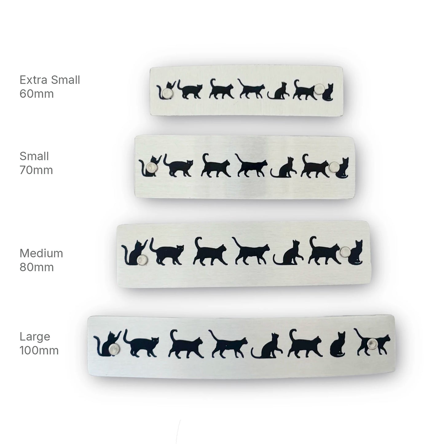 Four silver hair barrettes with French clasps featuring black cat silhouettes, shown in different sizes labeled Extra Small 60mm, Small 70mm, Medium 80mm, and Large 100mm, handmade in North Carolina.