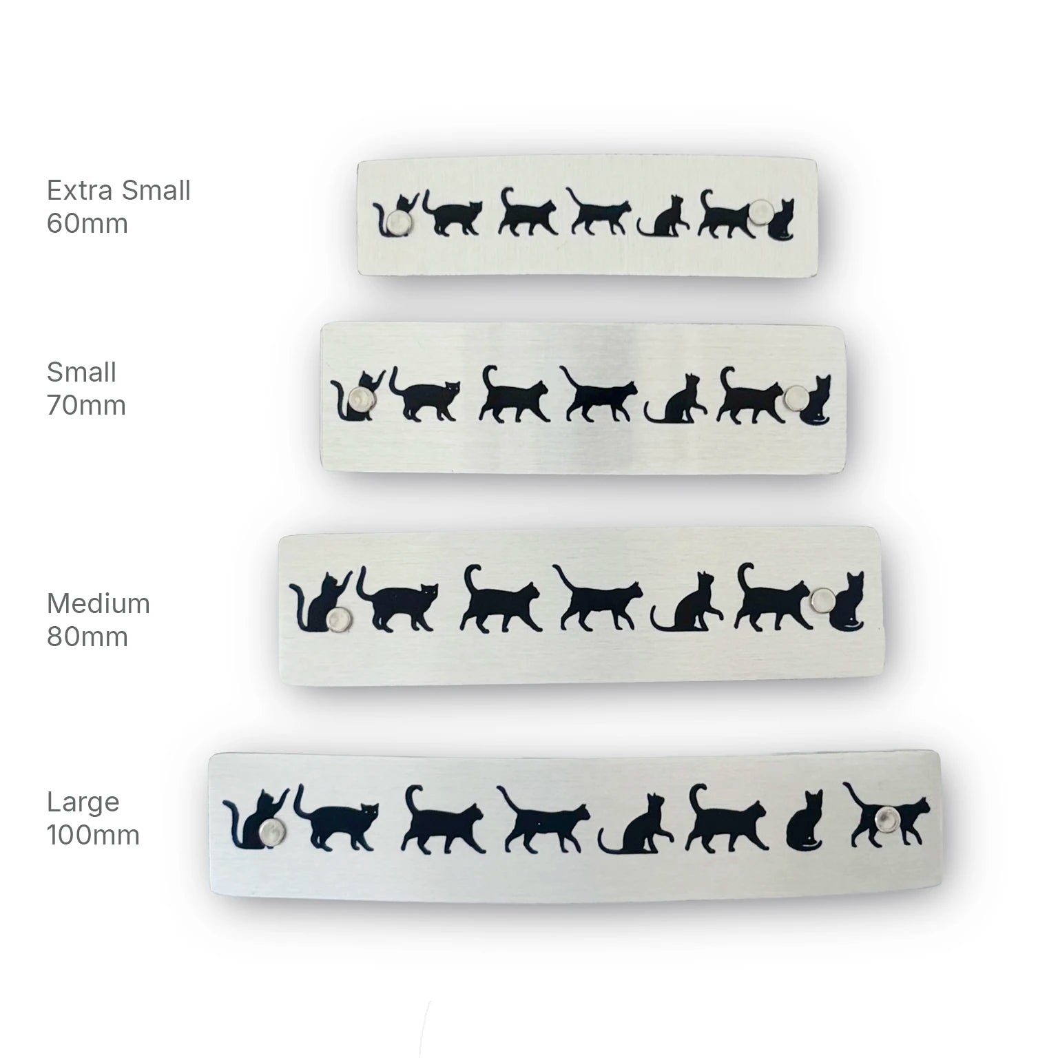 Four silver hair barrettes with French clasps featuring black cat silhouettes, shown in different sizes labeled Extra Small 60mm, Small 70mm, Medium 80mm, and Large 100mm, handmade in North Carolina.