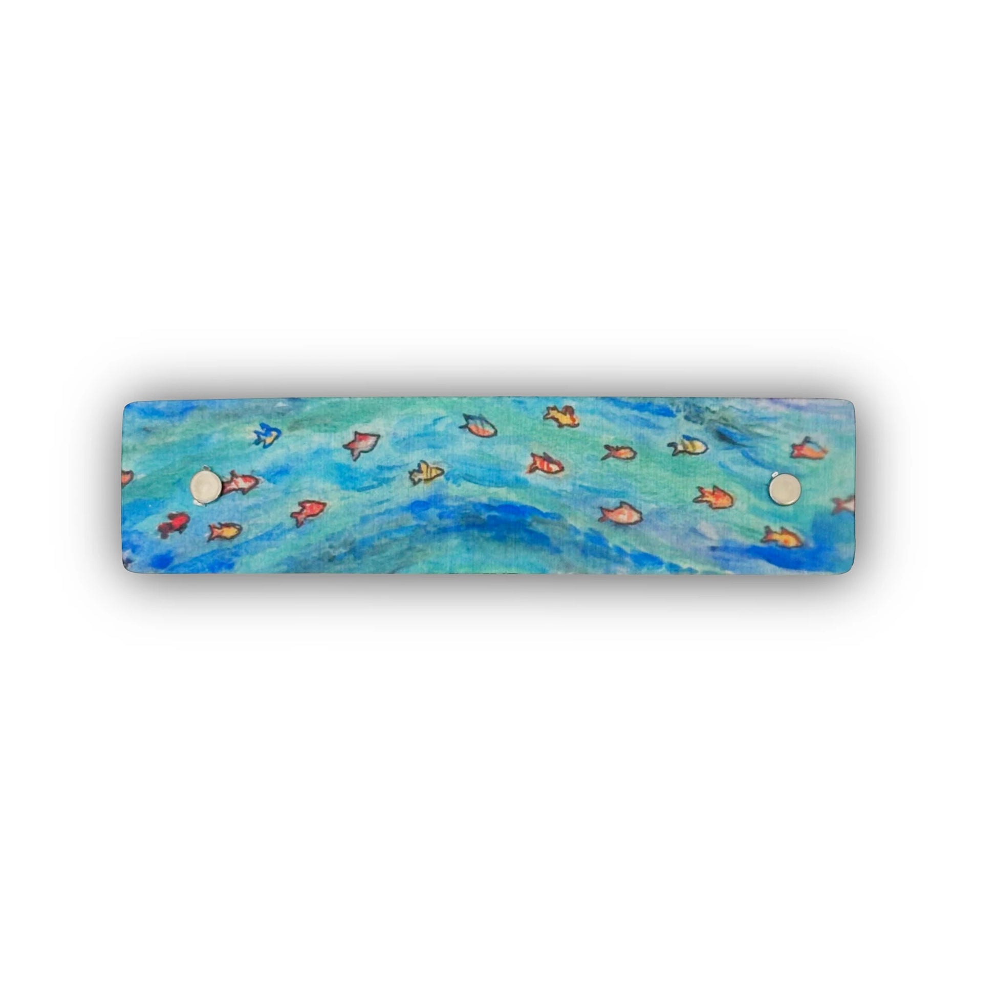 A rectangular French barrette featuring a painted ocean scene with blue and turquoise water and small orange and red fish on a white background.
