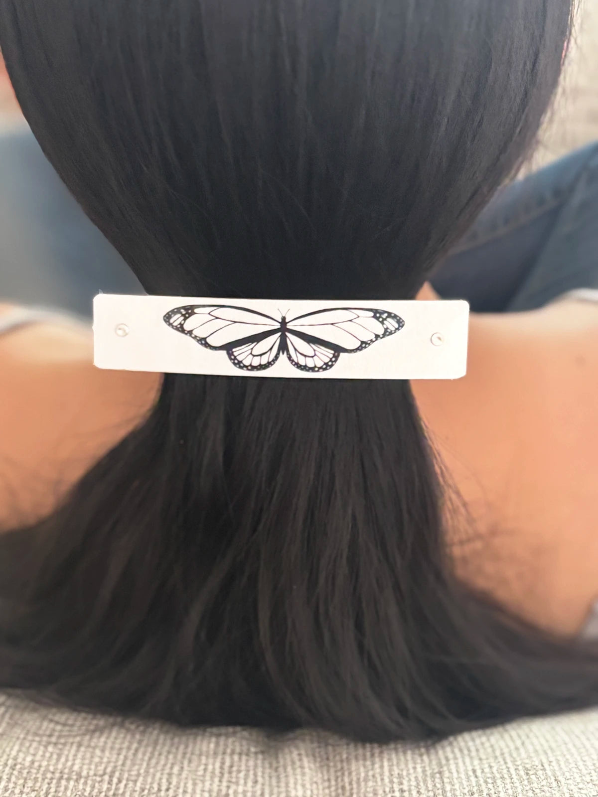 Ponytail hair clip (Large) with a black butterfly design, handmade in North Carolina by Robbin V. Davis Studio.