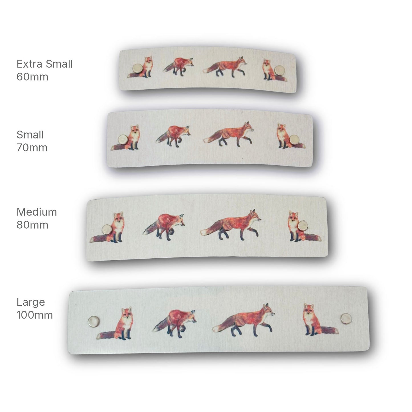 Four hair clips shown in different sizes (Extra Small 60mm, Small 70mm, Medium 80mm, Large 100mm) on a white background, each decorated with a row of illustrated red foxes.