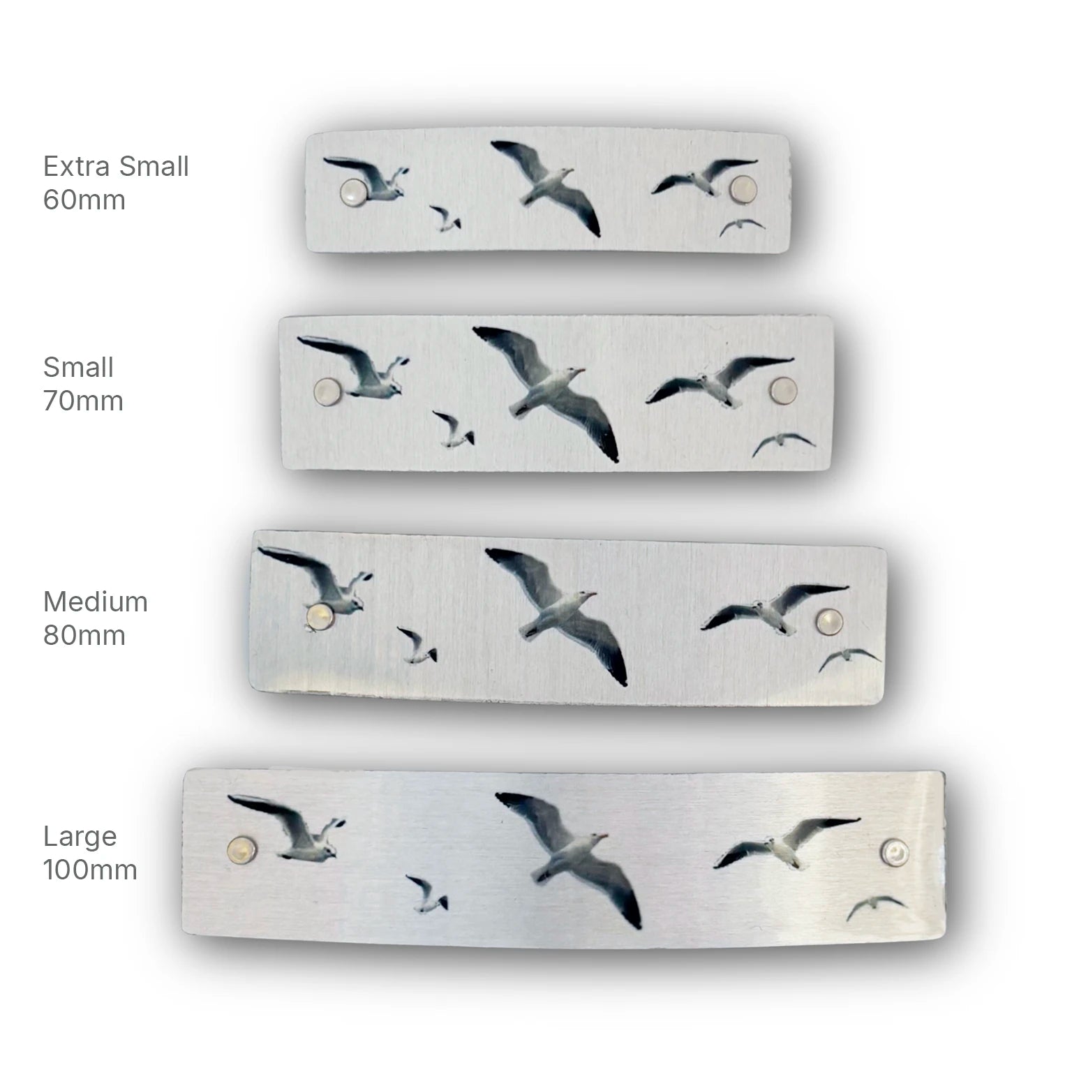 Four sizes of seagull hair clips, handmade in North Carolina.