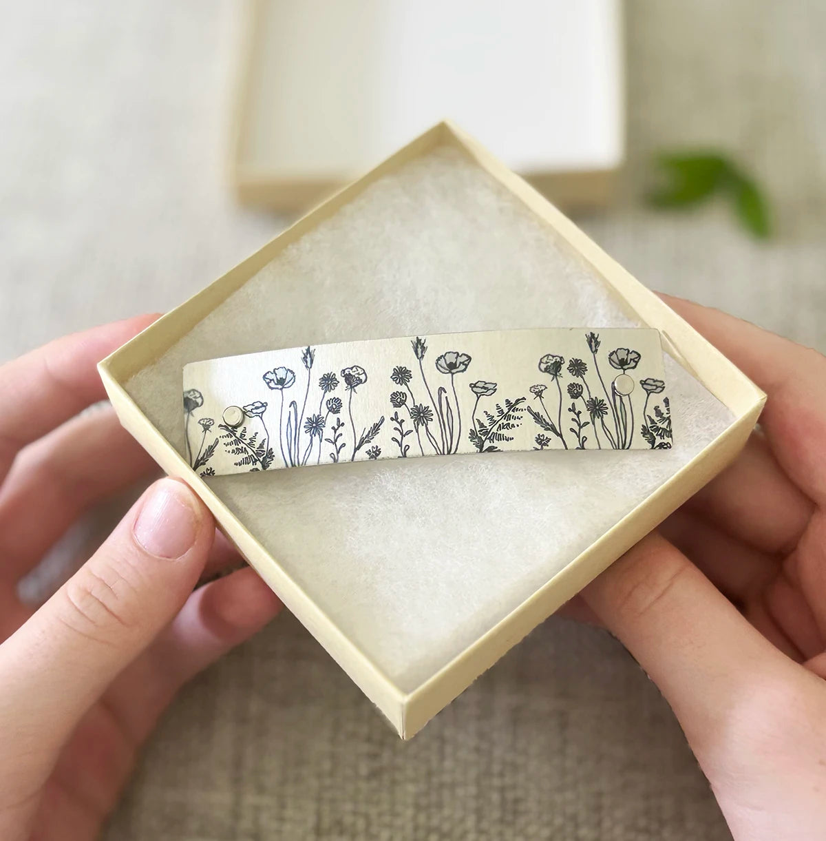 Wildflower hair clip, in open gift box. Botanical floral line drawn design