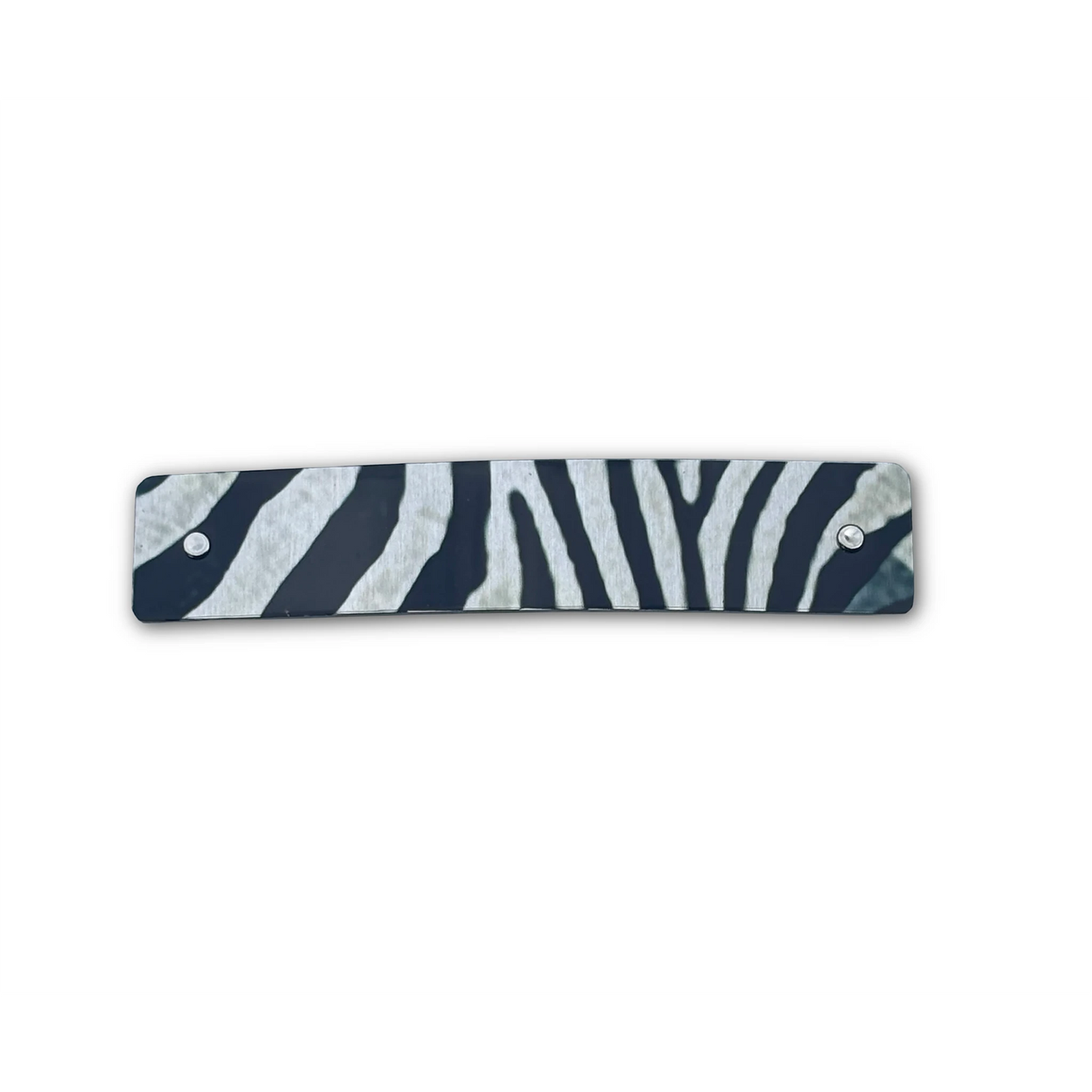 Zebra print barrette in black, gray, and silver on a white background.
