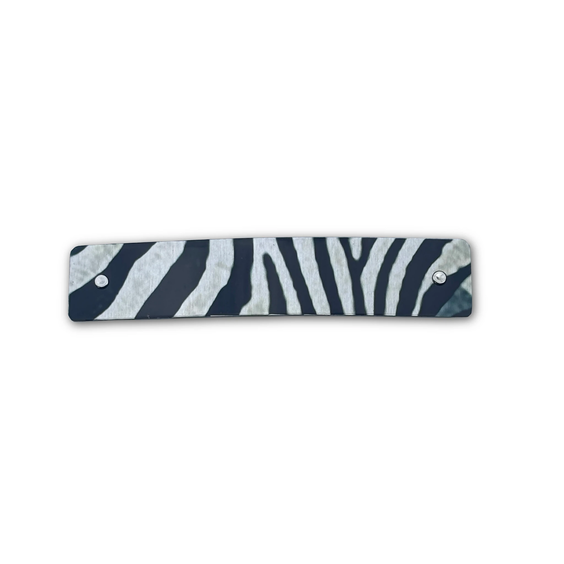 Zebra print barrette in black, gray, and silver on a white background.